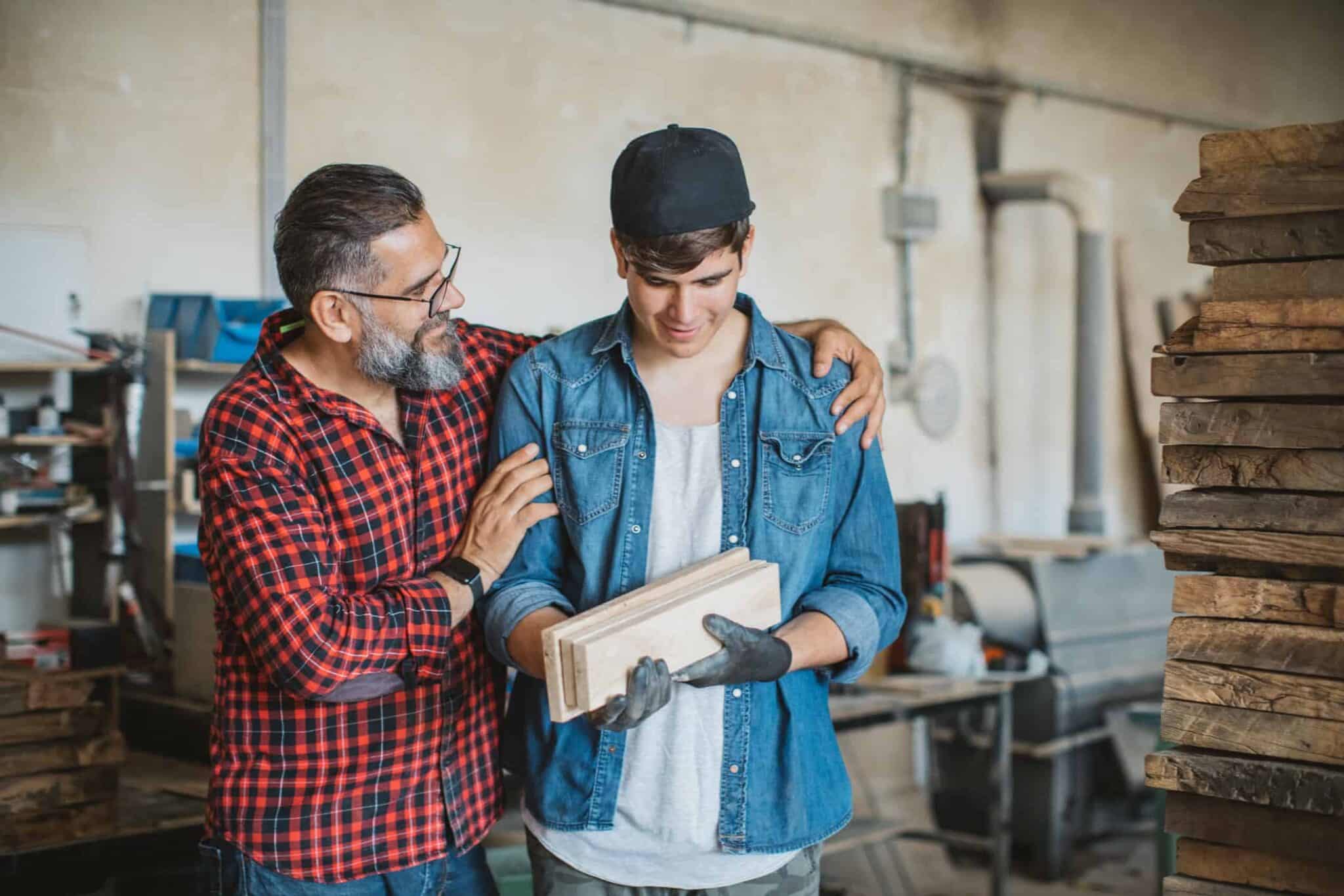 Man teaching son woodworking
