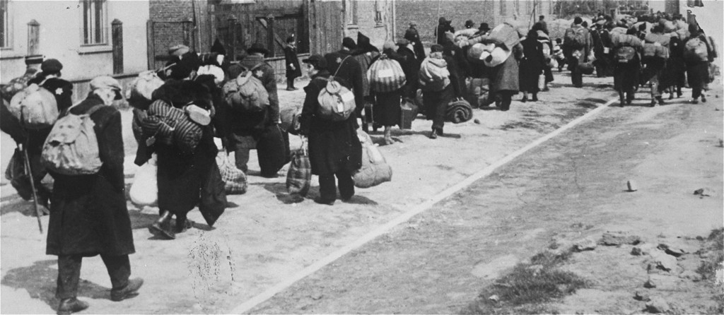 Jews carrying their possessions during deportation to the Chelmno killing center.