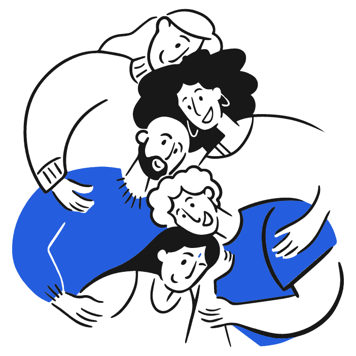 A mom and dad hug their grown children